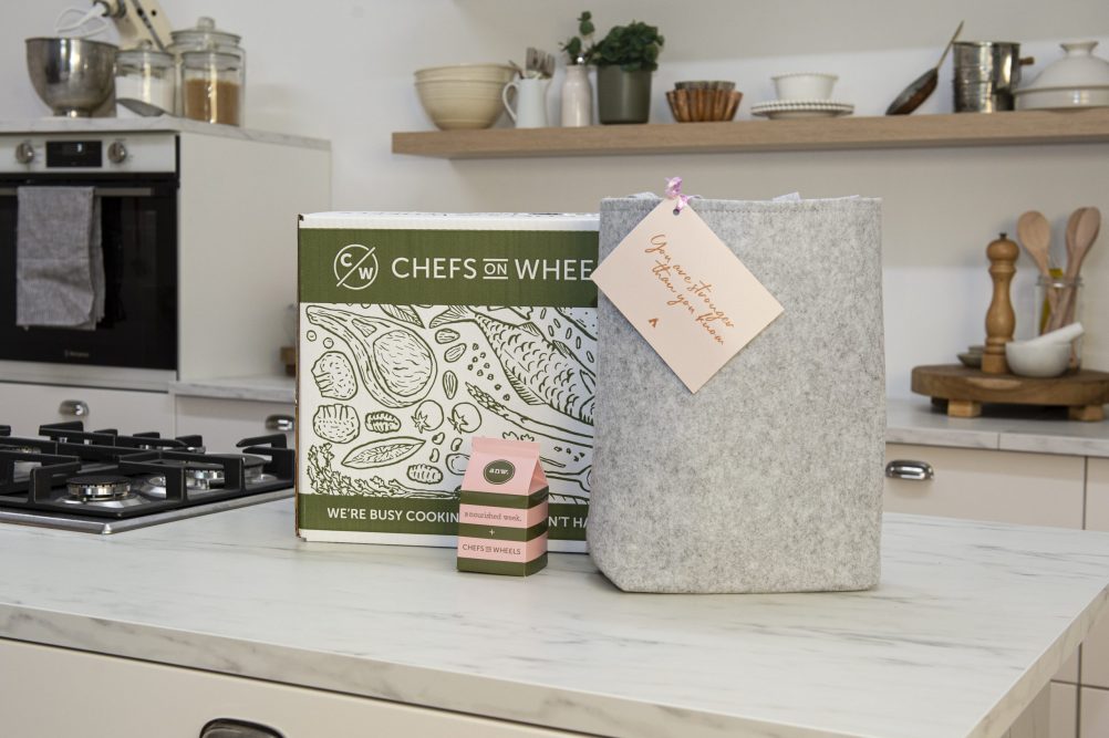 Chefs on wheels box with village co bag