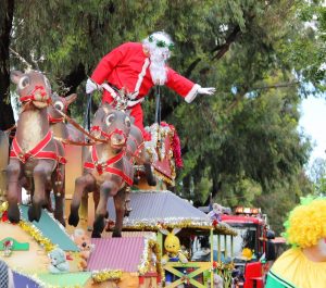 Santa Claus waving at Norwood Christmas Pageant