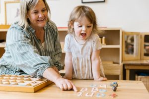 Teacher and child engage at Hills Montessori Preschool