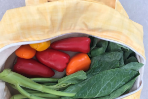 Fresh produce sits in a bag.