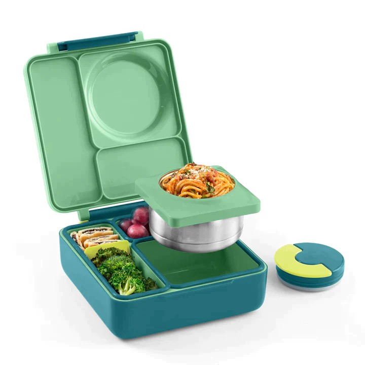 Green lunchbox filled with healthy food.