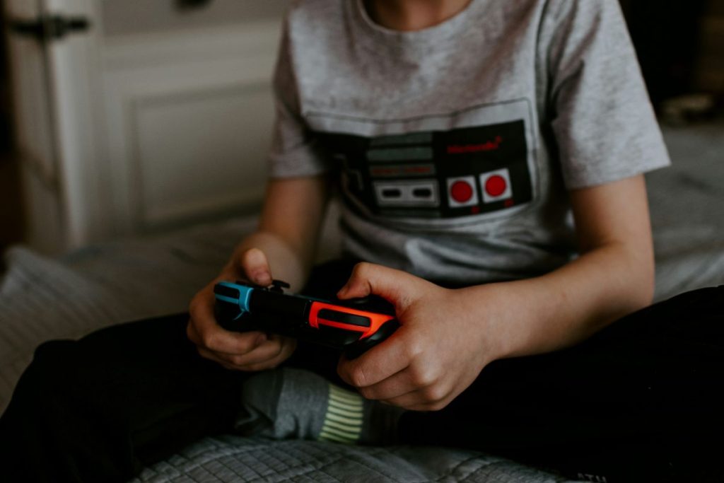 Child playing video game.