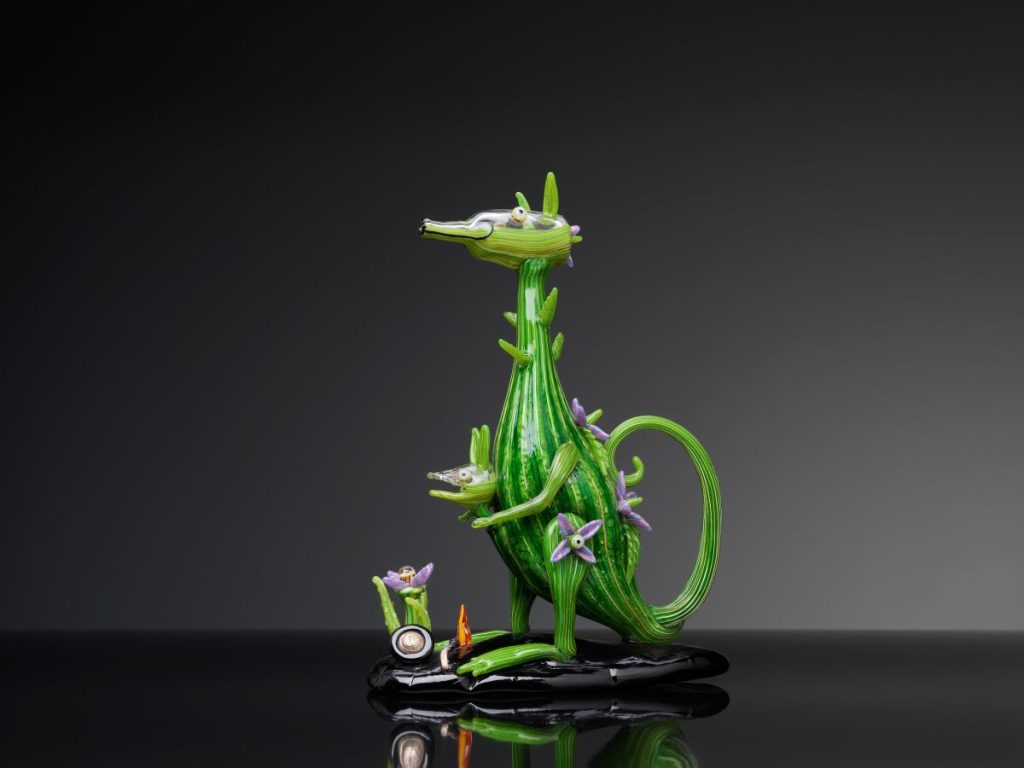 A green dragon statue featuring a vibrant green head and body, showcasing intricate details.