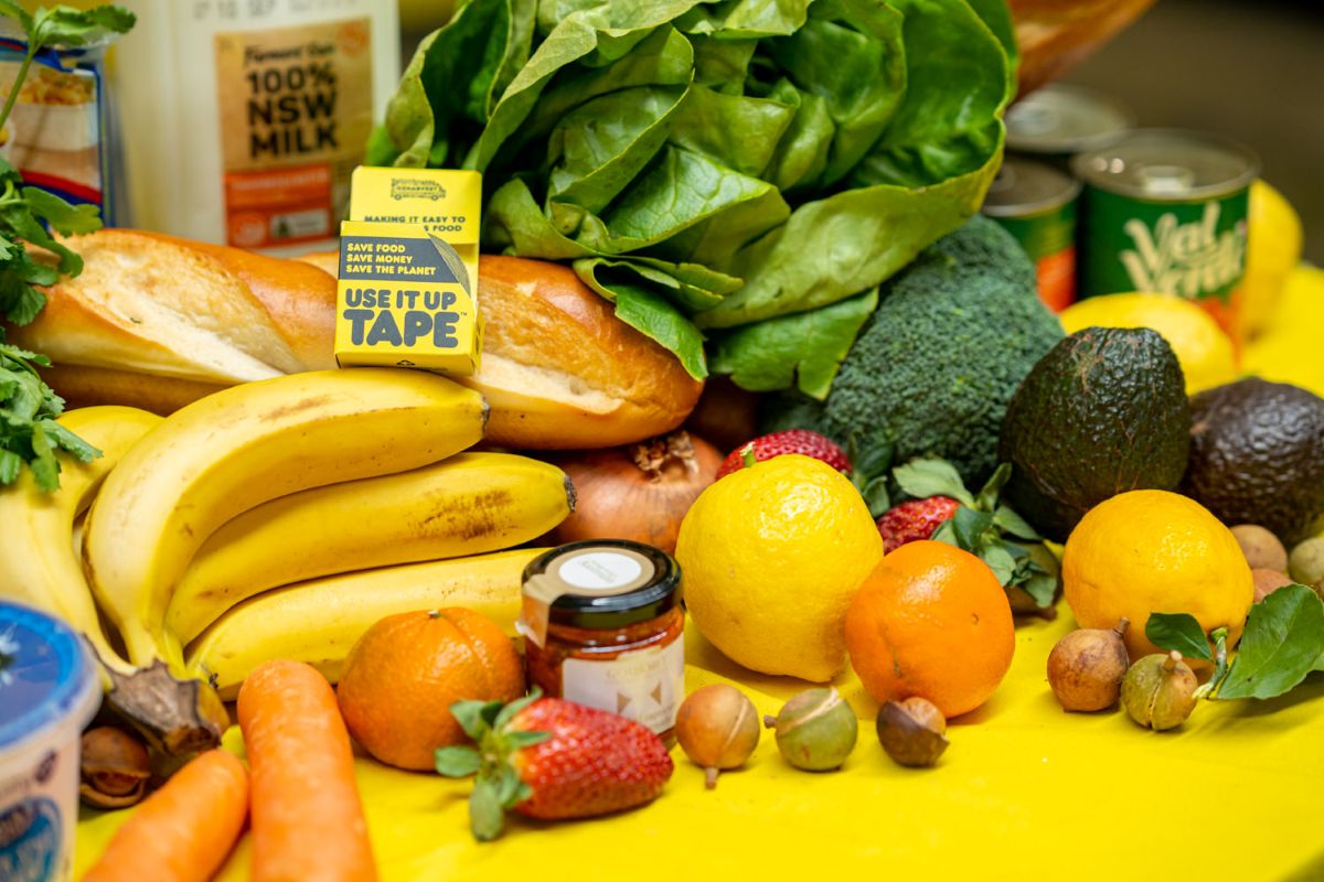 A colorful table filled with a variety of fresh fruits and vegetables, showcasing nature's bounty.