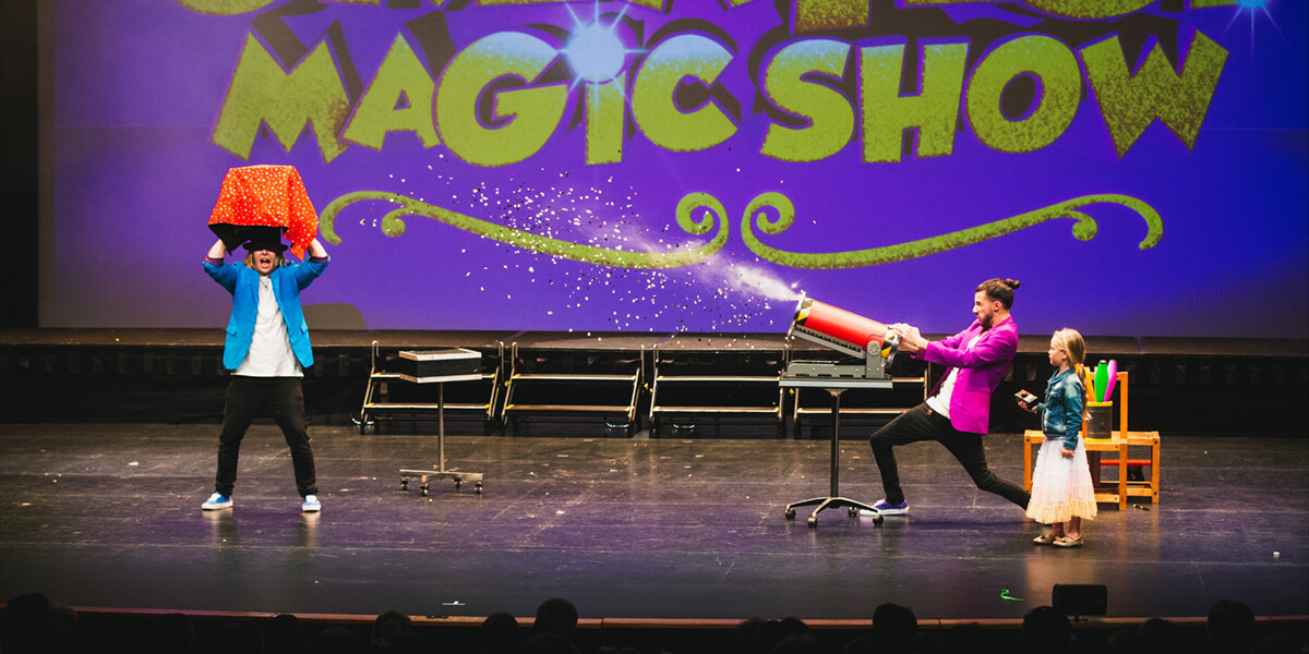 A magician performs an enchanting trick, captivating an audience with wonder and excitement.