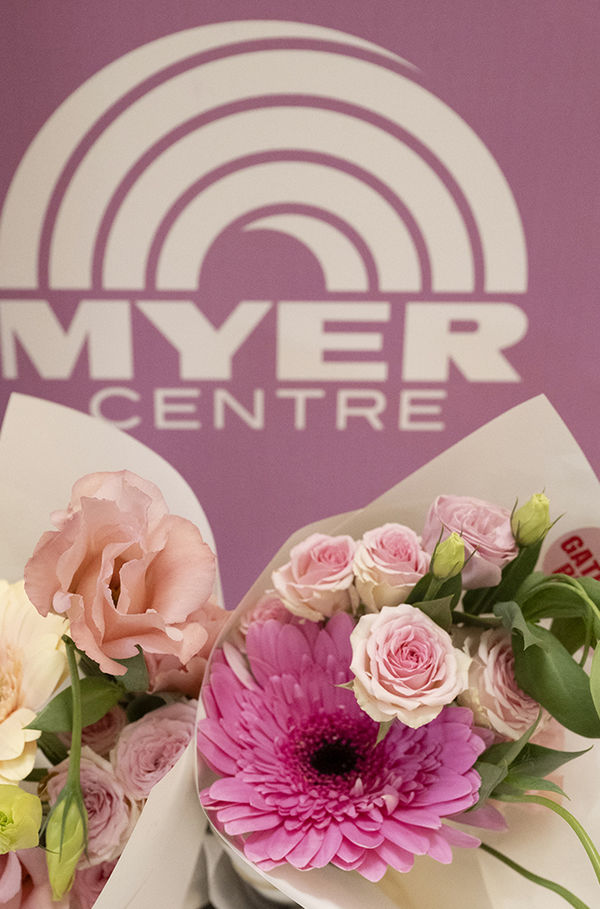 Colorful flowers displayed at the Myer Centre, adding vibrancy to the shopping environment.