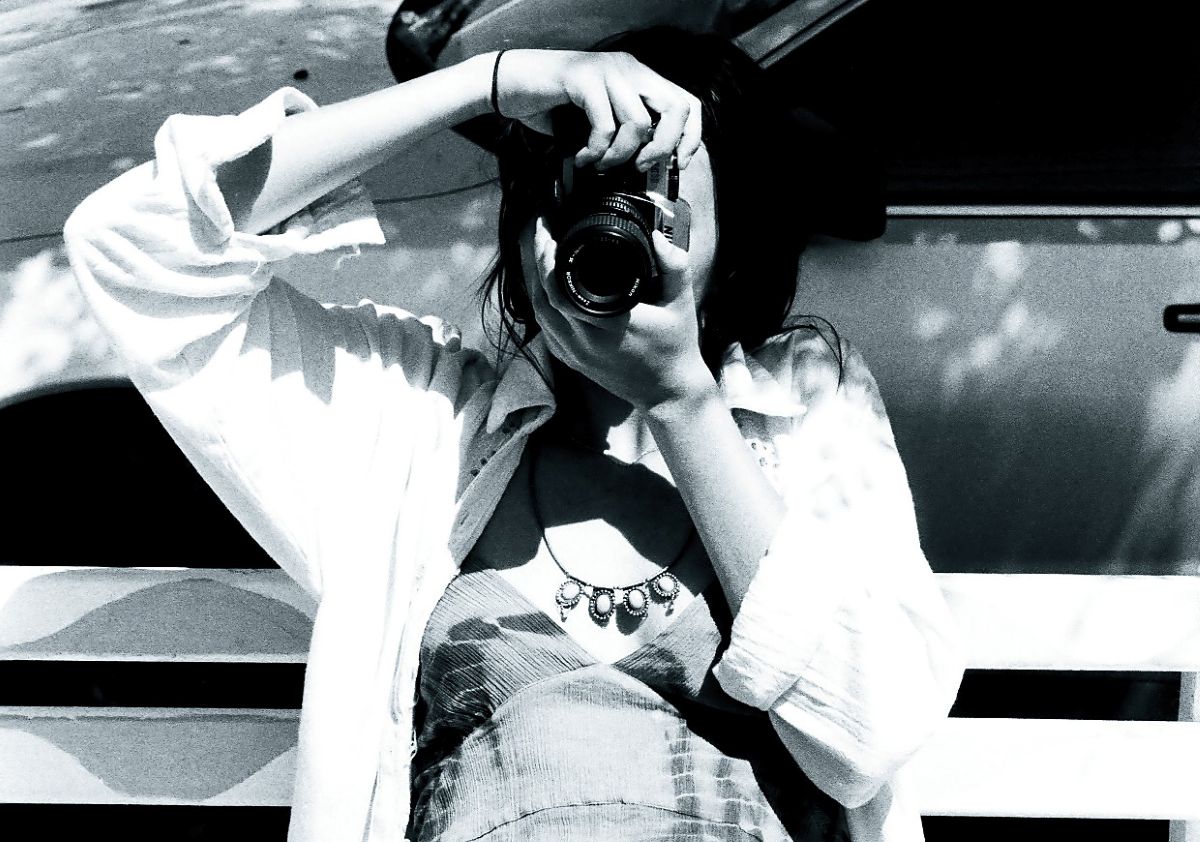 A girl taking a photo.