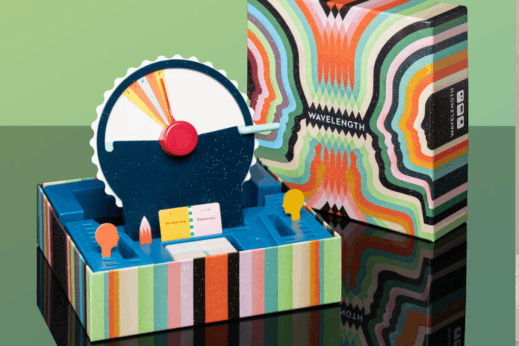 A vibrant box containing a round clock, showcasing colorful designs and a clear clock face.A vibrant box containing a round clock, showcasing colorful designs and a clear clock face.