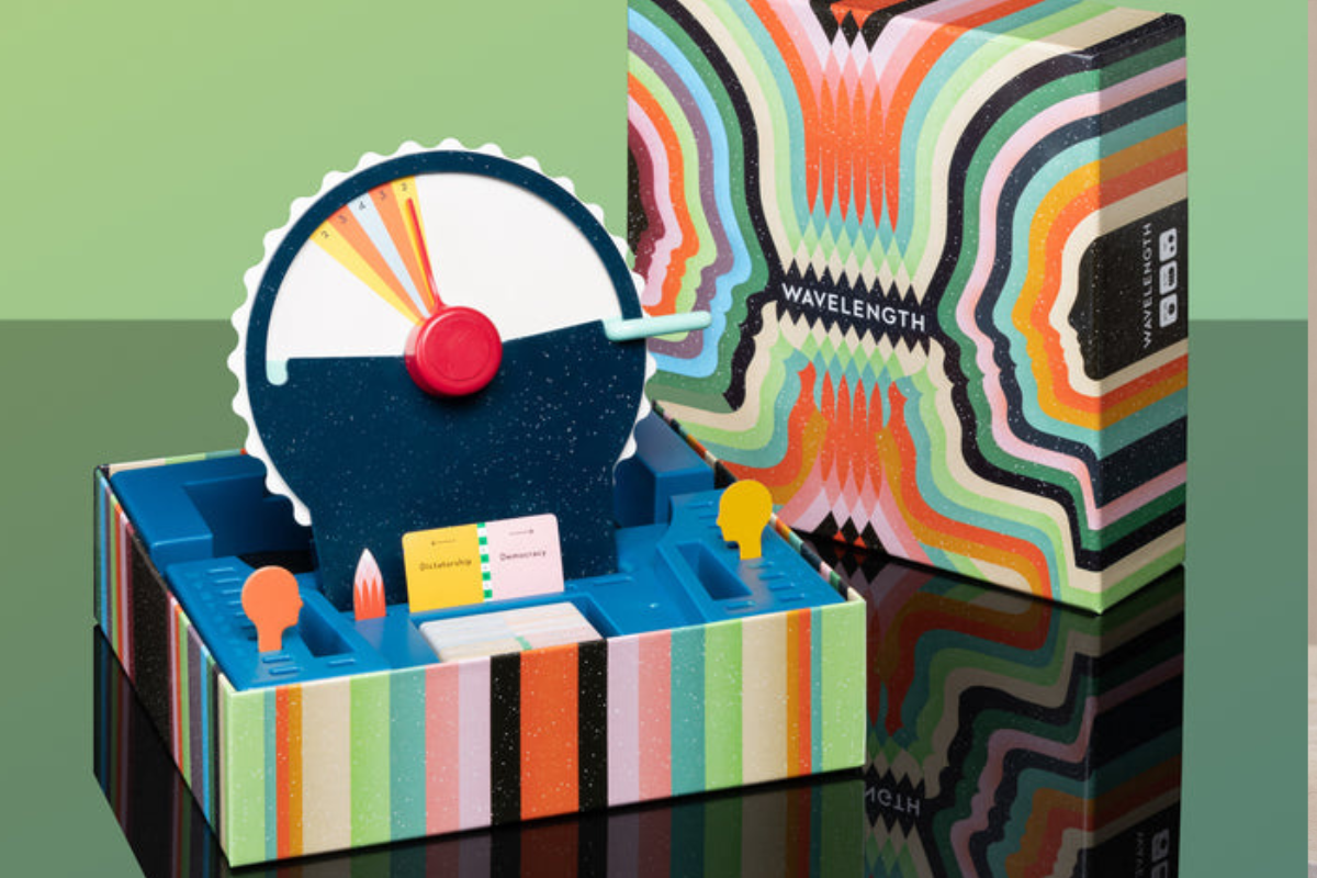 A vibrant box containing a round clock, showcasing colorful designs and a clear clock face.A vibrant box containing a round clock, showcasing colorful designs and a clear clock face.