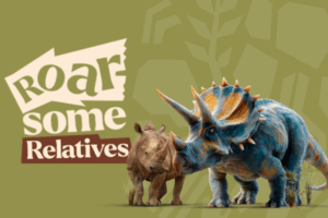 A dinosaur and a rhino stand side by side in a natural setting, showcasing their contrasting sizes and features.