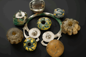 A colorful bracelet featuring a variety of beads and decorative items.