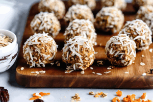 Carrot cake bites on a cutting board.