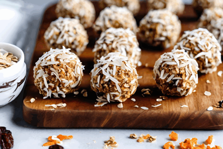 Carrot cake bites on a cutting board.