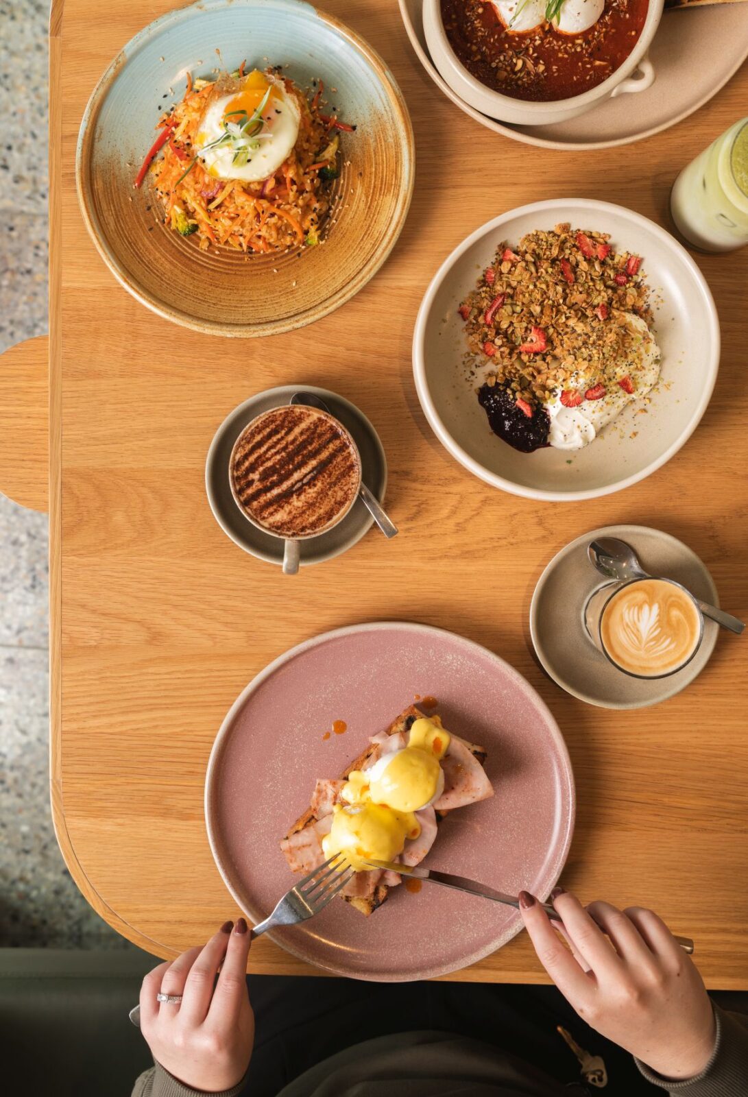 A table filled with various plates of food, showcasing a colorful assortment of dishes and culinary delights.