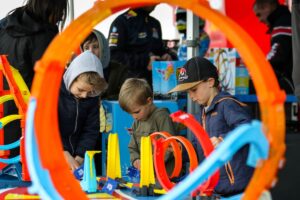 Kids playing on a race track.
