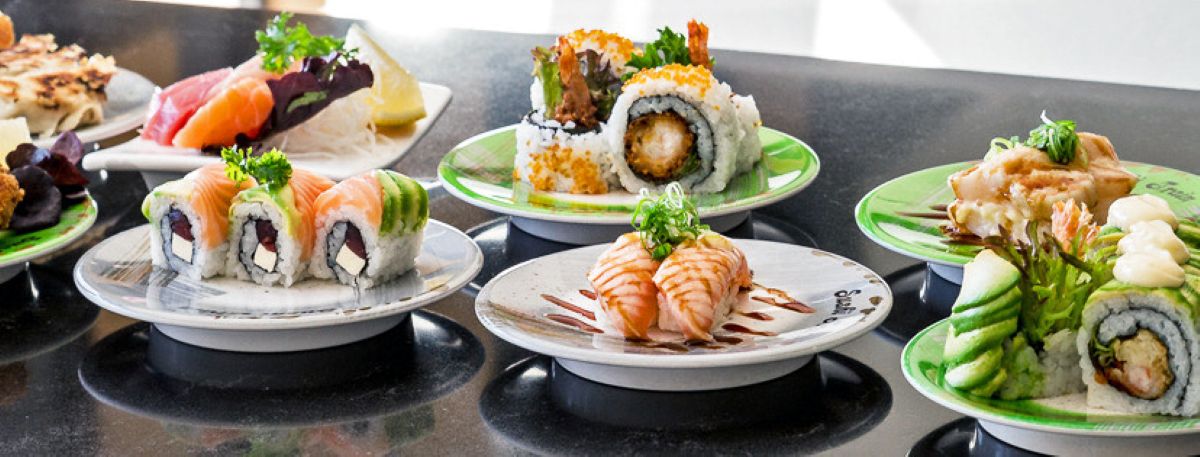 Sushi plates on a table.