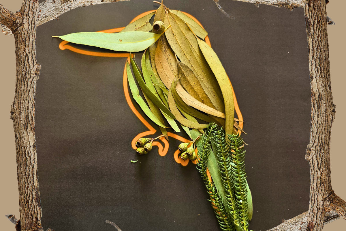 A bird sculpture crafted from leaves and branches, showcasing intricate natural textures and forms.
