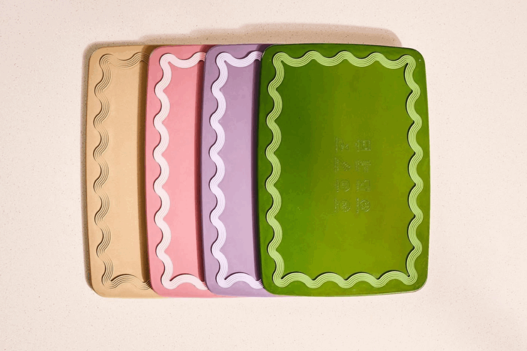 Three colorful plastic chopping boards