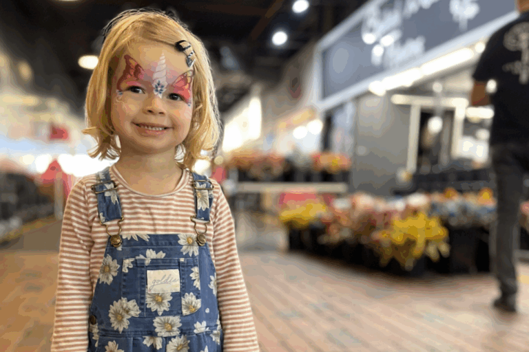 Child with face painted.