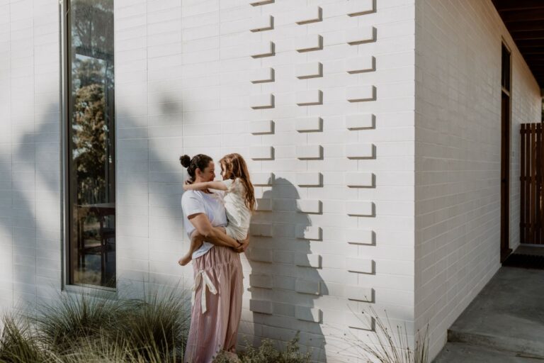 A mum embraces her child.