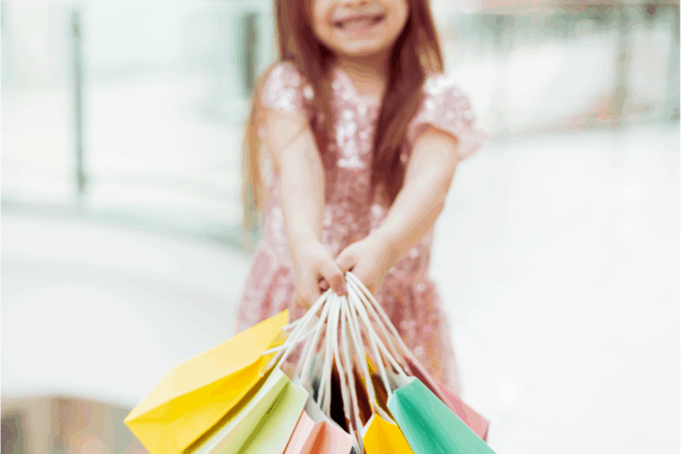 Girl holds shopping bags.