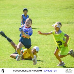 Adelaide University Sport & Fitness - kids running with a ball in on a field.