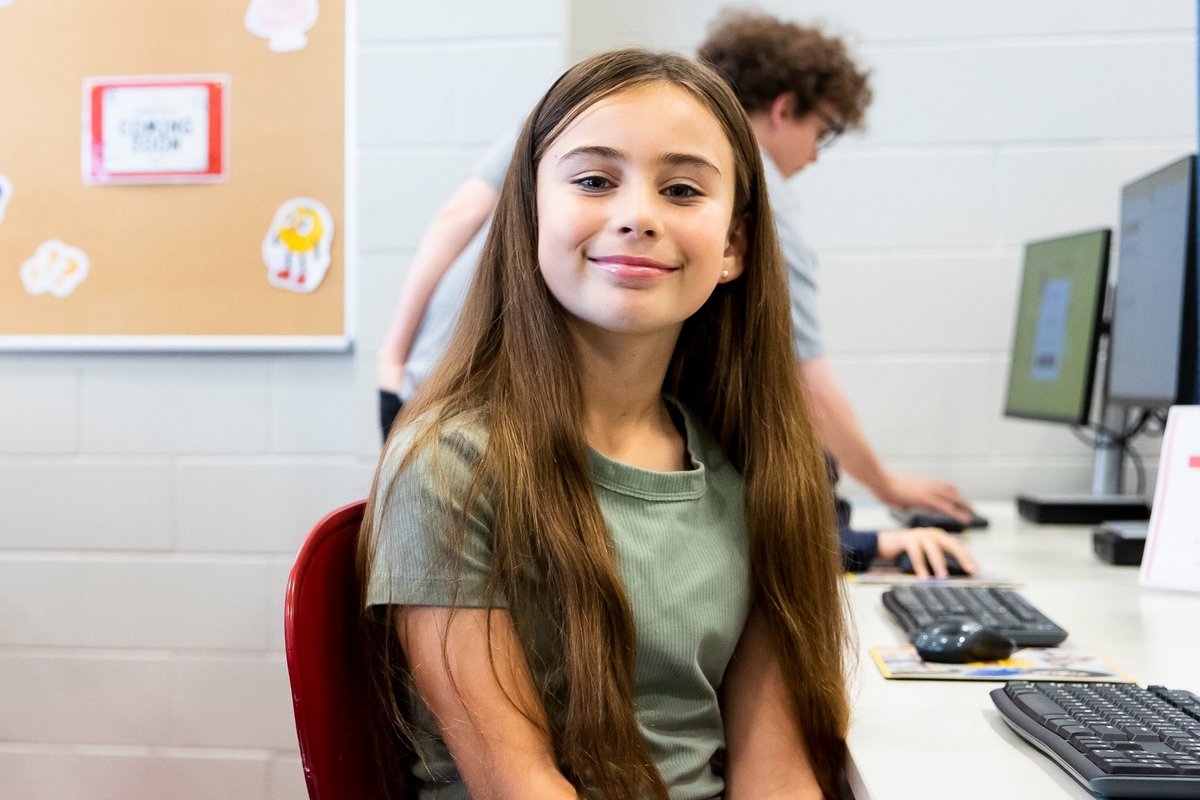 NumberWorks’n Words April holiday program. Student in green tee.