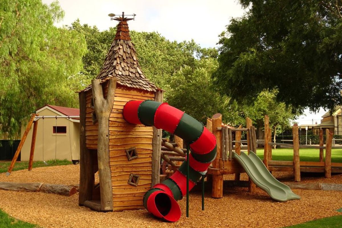Wooden castle playground with spiral tube slide at Princess Elizabeth Playground in Adelaide