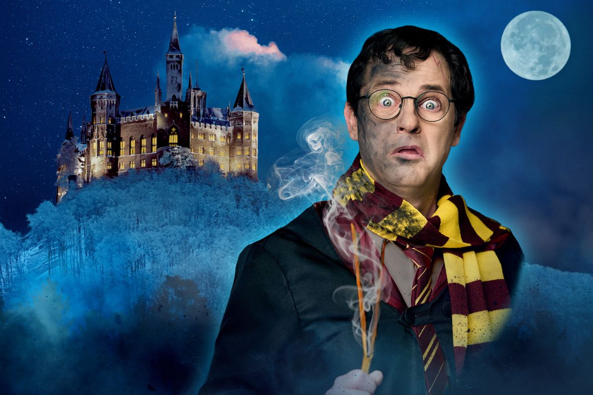 A magician dressed as Harry Potter with a want and moonlit mystical background.