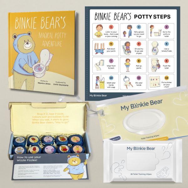 A box containing a book and various other items arranged neatly inside.