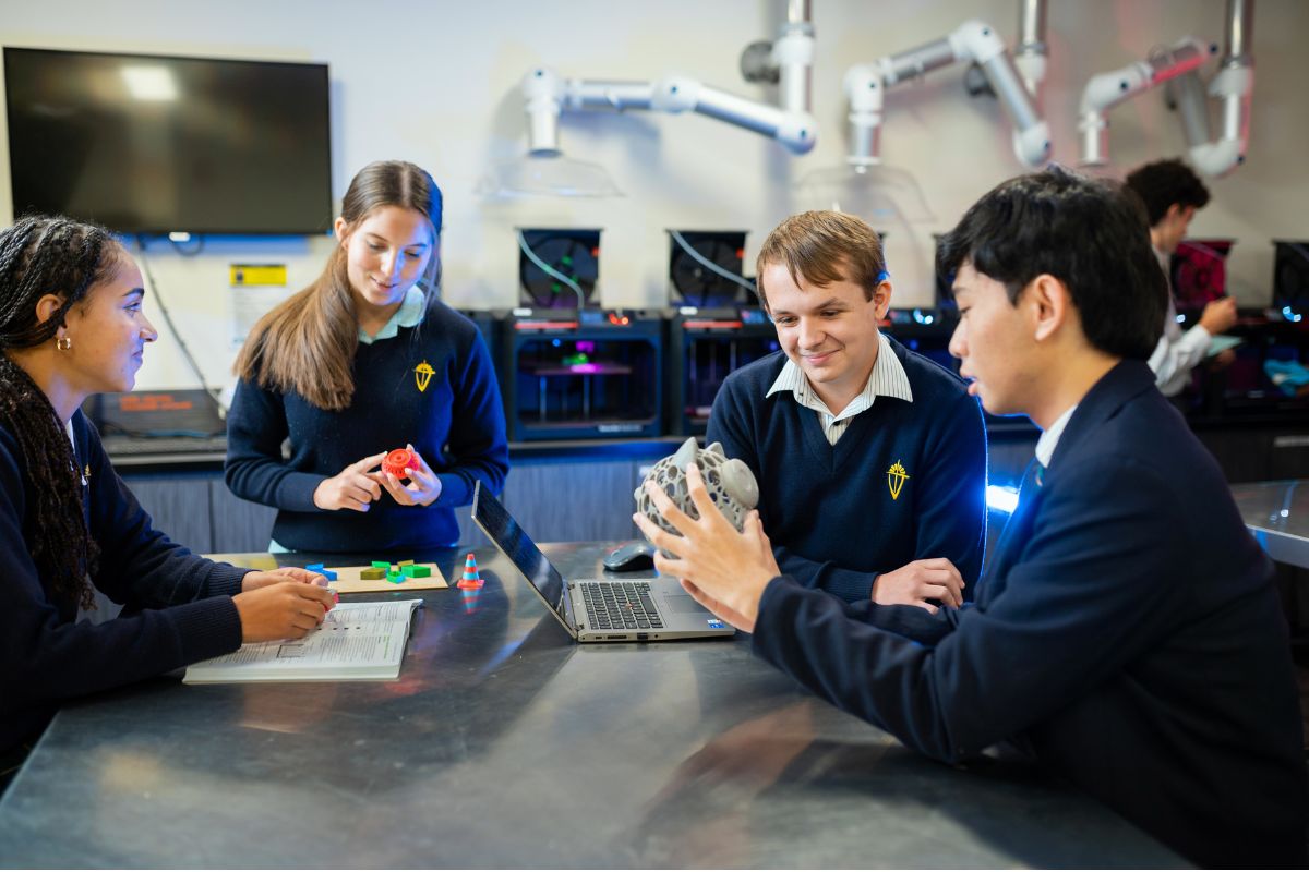 Endeavour College Adelaide students gather round a technical class studio.