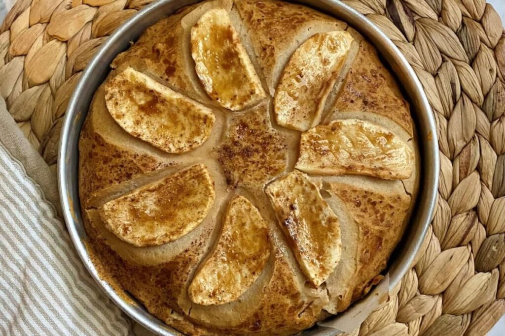A freshly baked apple pie in a rustic setting.