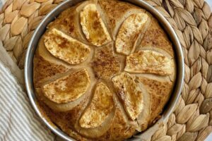 A freshly baked apple pie in a rustic setting.