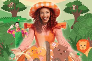 Poster of Emma Memma Jungle Picnic Tour. Woman dressed in oragne dress and hat with an animated background including trees and animated characters.