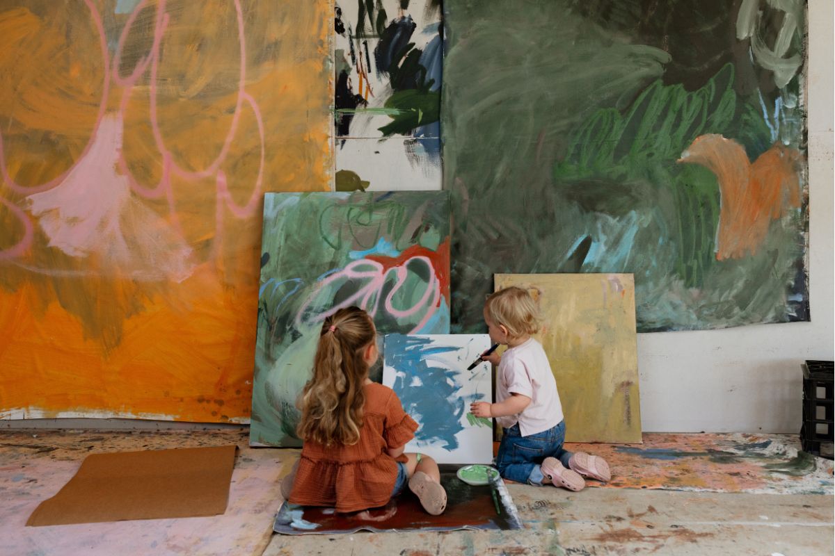 Artist Madeleine Collopy's children painting in her art studio.