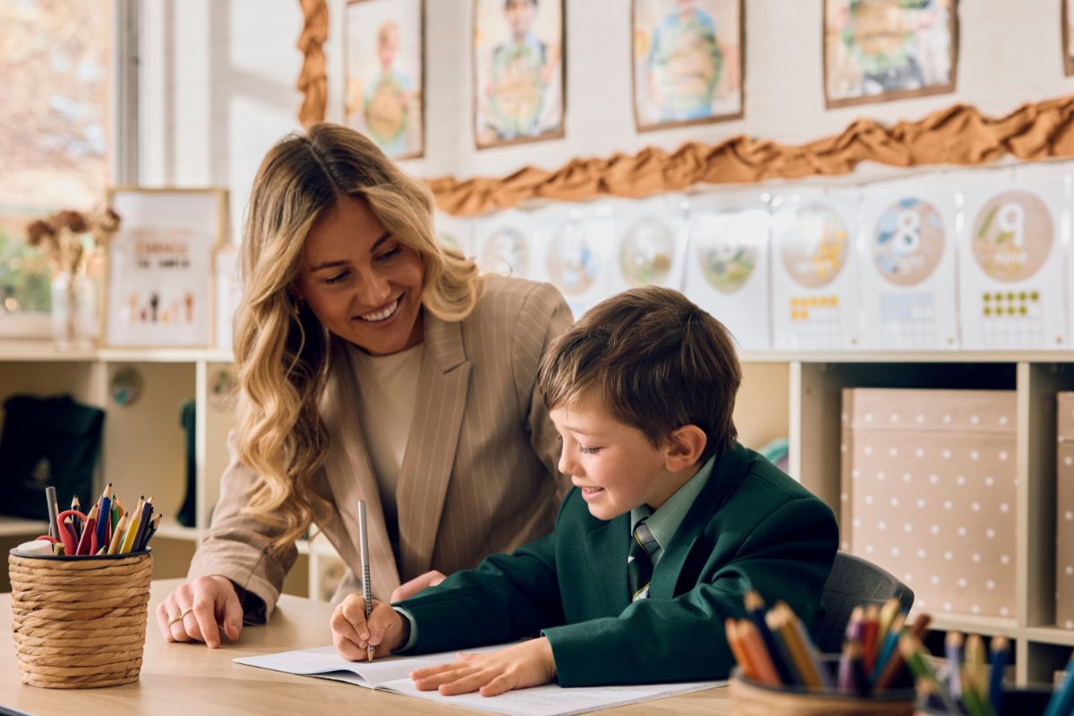 Student and teacher in a classroom setting.
