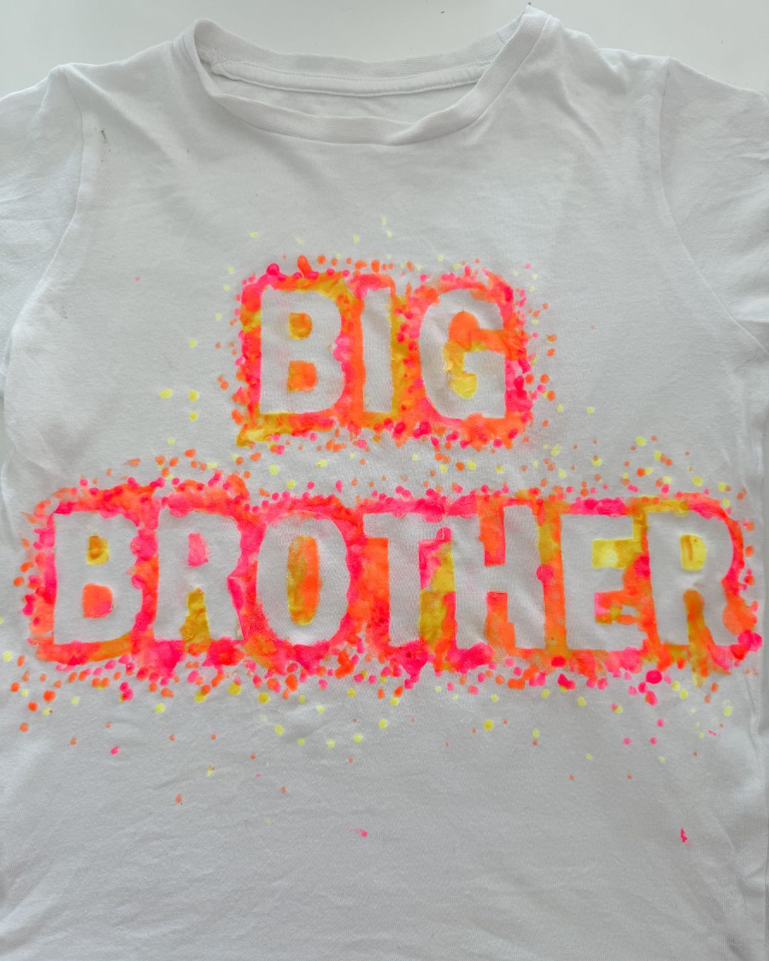 Big Brother painted onto a white t-shirt.