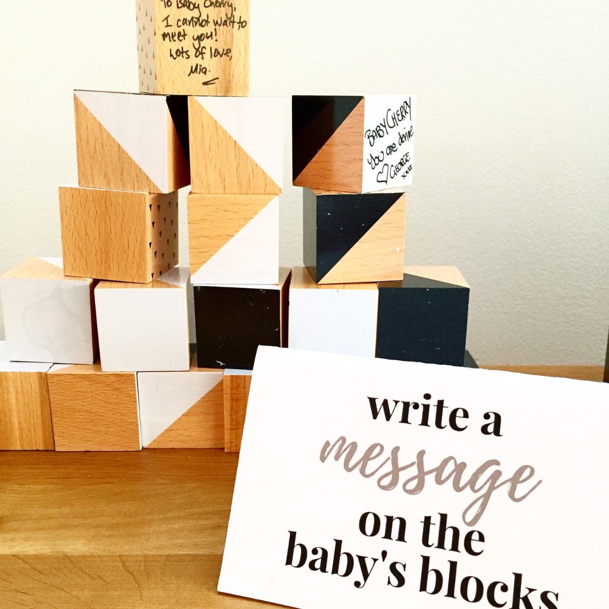 Baby blocks next to a sign to 'write a message on the baby's blocks'.