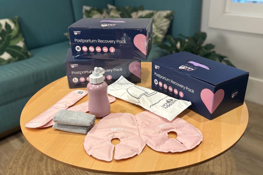 Happy Kat postpartum recovery kit product shot displayed on a table.