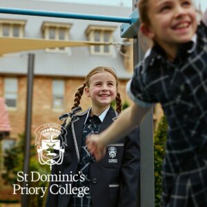 St Dominic's Priory College school girls in school uniform in their school playground.