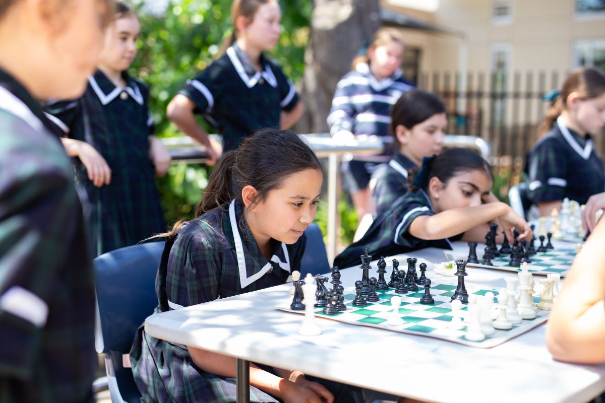 Seymour College students playing an outdoor game of chess.
