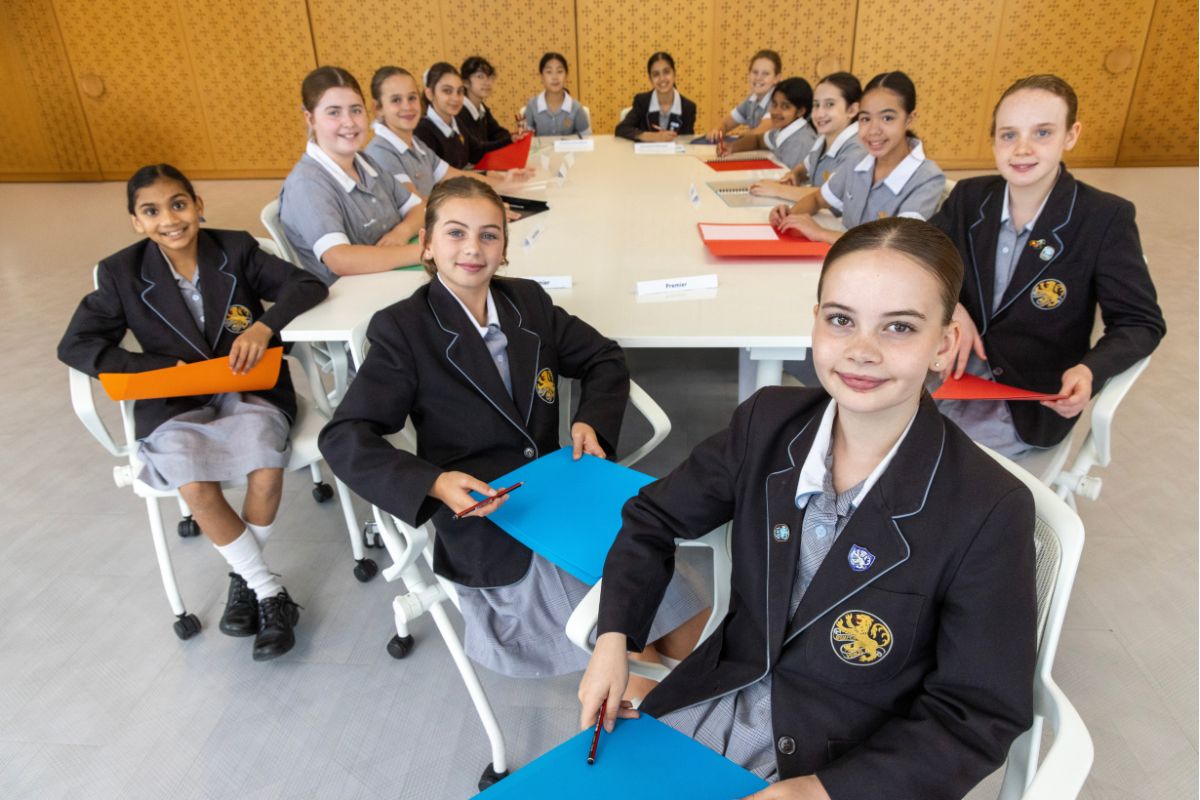 Wilderness students around a classroom table.