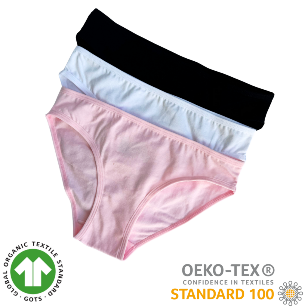 Three pairs of Billie Green organic cotton underwear in pink, white and black, displayed with OEKO-TEX Standard 100 and Global Organic Textile Standard certification logos.