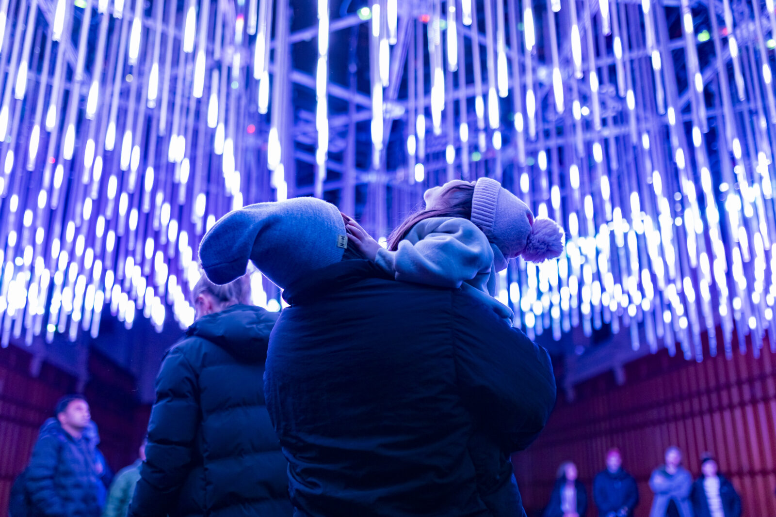 Families walking the free City Lights trail at night during Illuminate Adelaide 2026