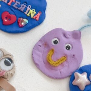 Colourful clay creations decorated with googly eyes, pipe cleaners, buttons and embellishments made by children at a Mini Ivy Art Studio session
