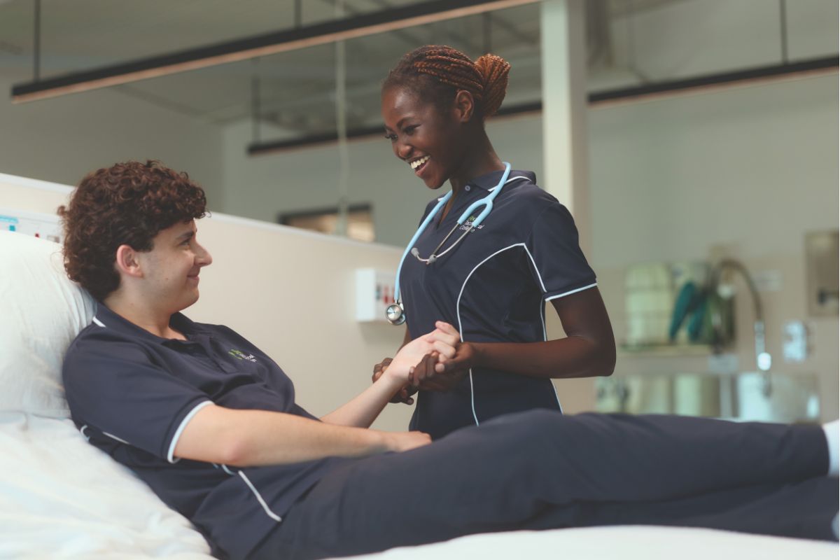 Two SA Technical College students practising health and support skills in a purpose-built simulated hospital facility