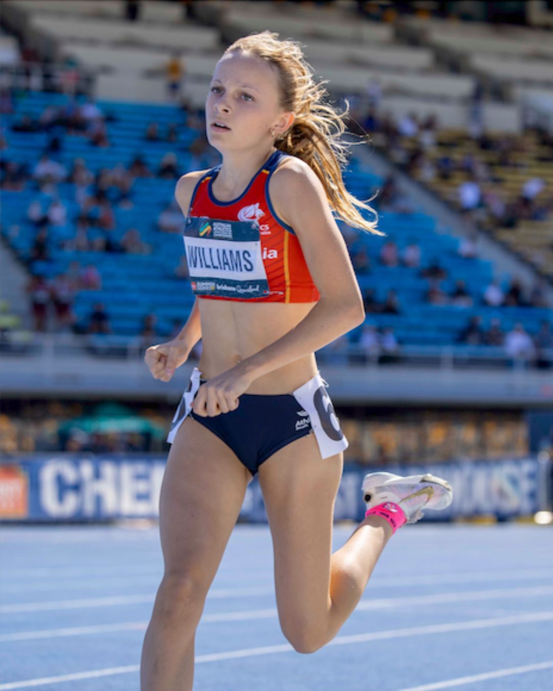 Tilly Williams competing on the athletics track wearing an SA representative singlet.