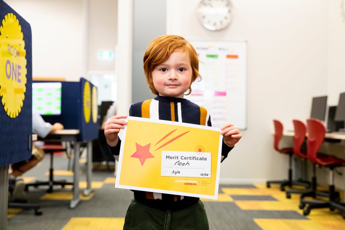 Child learning with NumberWorks'nWords tutor