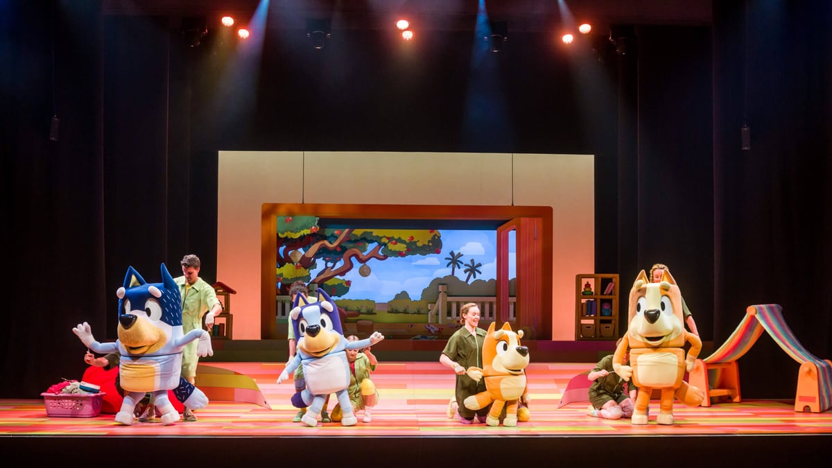 Bluey and Bingo performing on stage in Bluey's Big Play